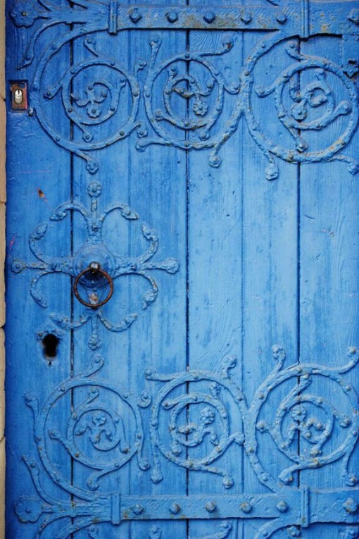 blue barn style door with accents