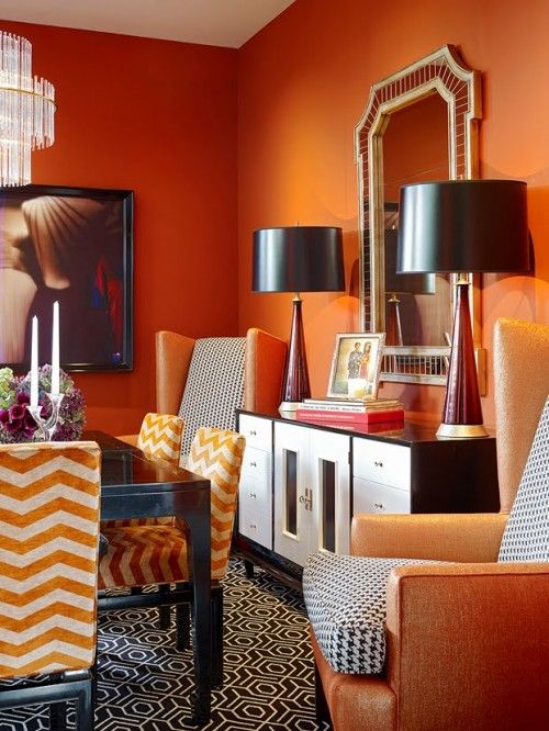 Orange patterned black and white living room 