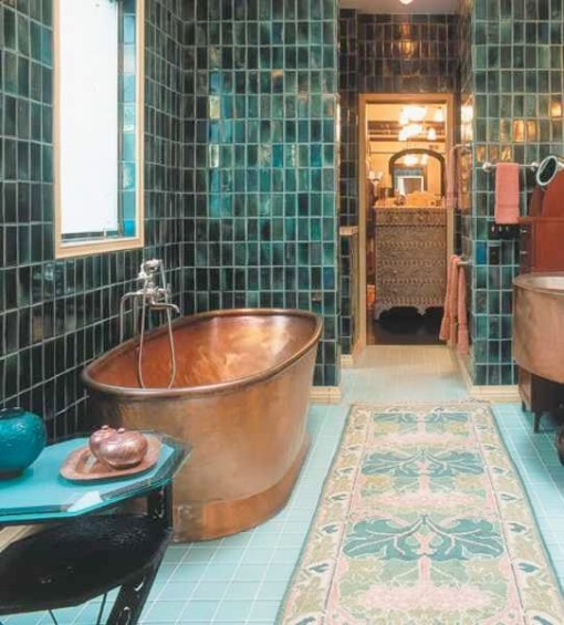Copper tub in blue bathroom