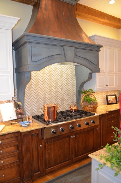 ASO show house kitchen hood faux painted copper