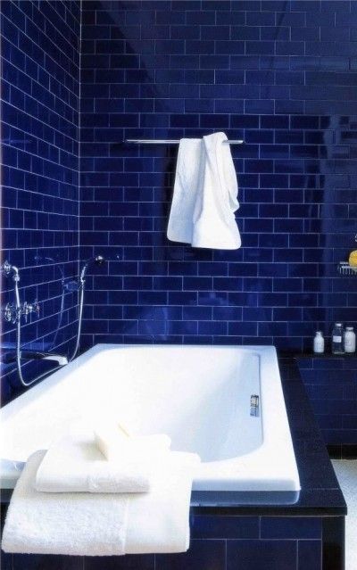 Bathroom with blue subway tiles 